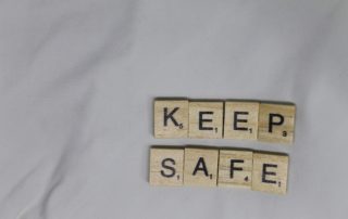 scrabble tiles that spell "keep safe"